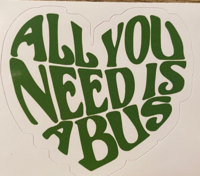 A heart shaped sticker that says " all you need is bus ".