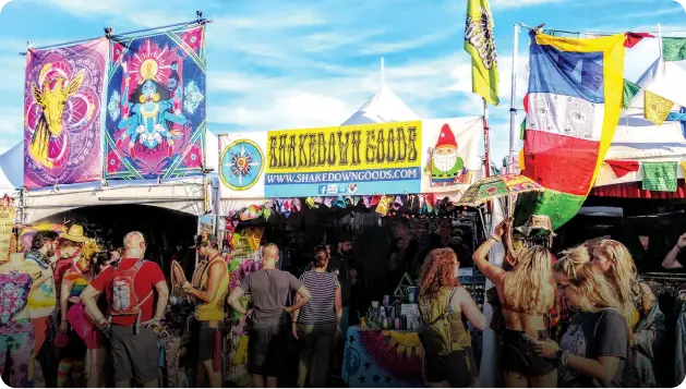 A crowd of people standing around at an outdoor event.