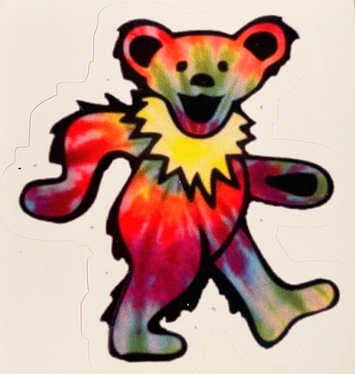 A colorful bear is standing on its hind legs.