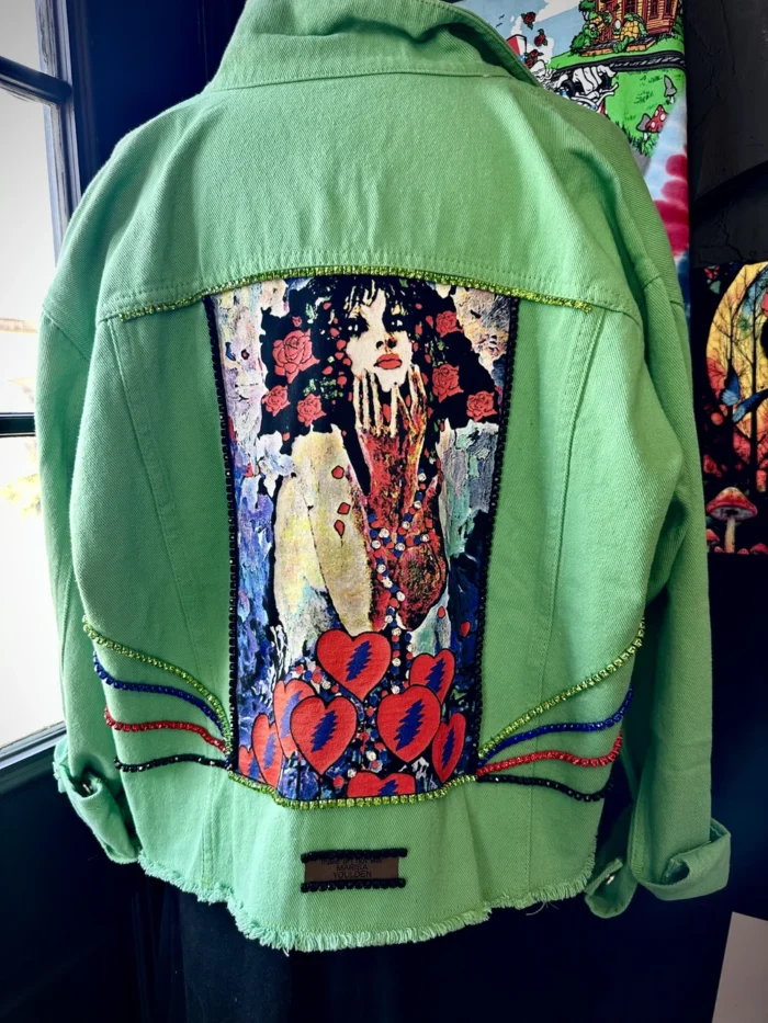 A green jacket with an image of a woman on it.