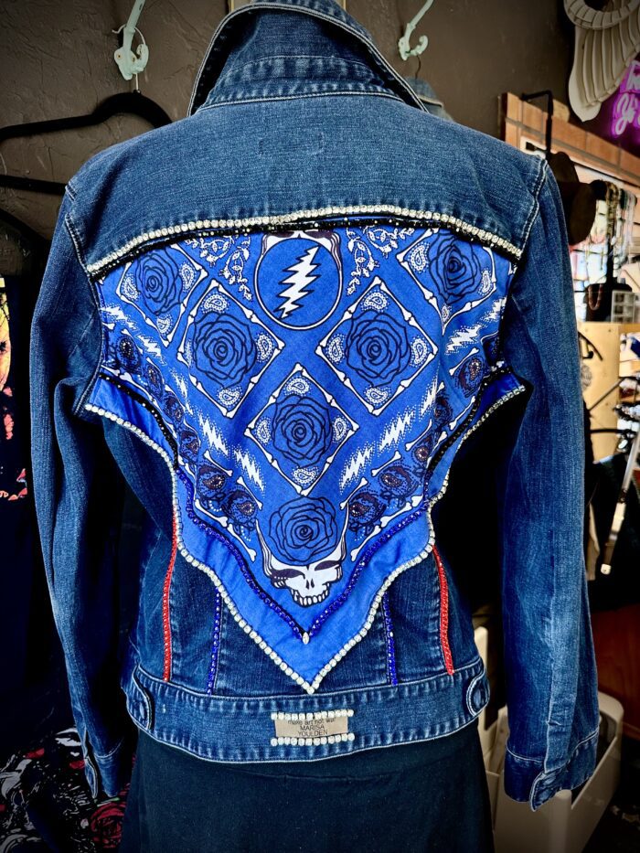 A blue jacket with a bandana on the back.