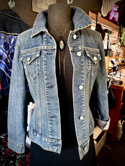 A jacket is shown on display in a store.