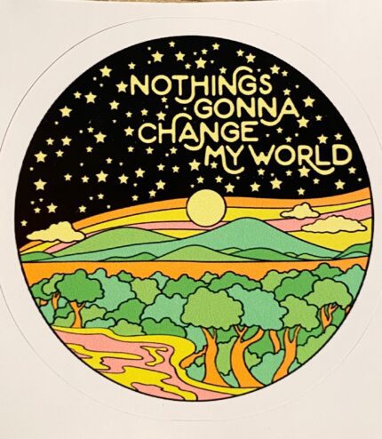 A sticker with trees and mountains in the background.