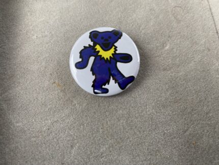 A button with a blue bear on it