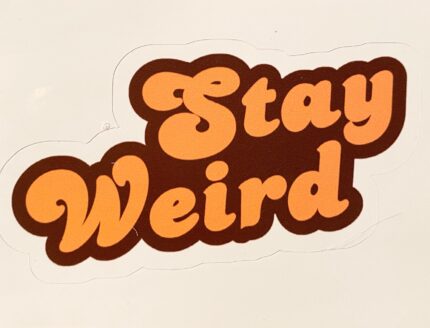 A sticker that says stay weird on it.