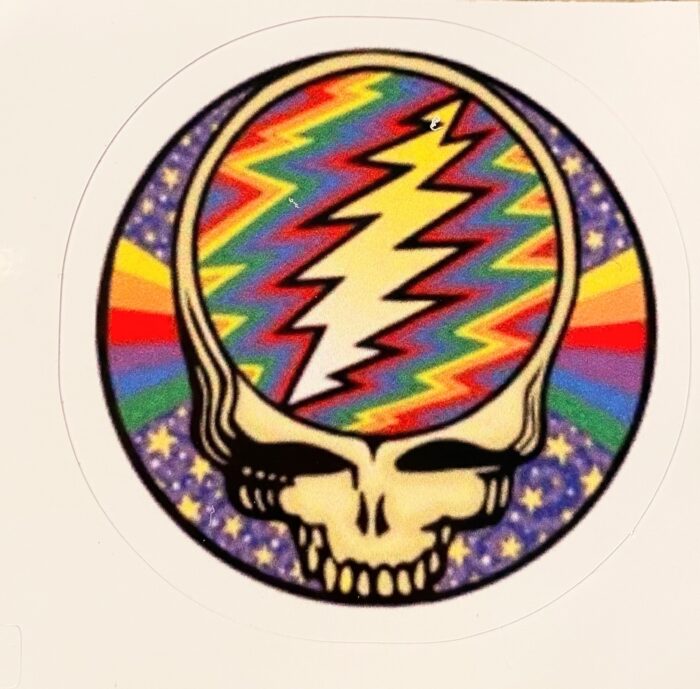 A sticker of the grateful dead with a rainbow background.