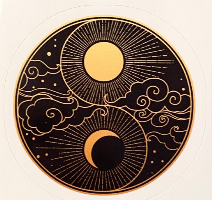 A black and gold yin yang with sun and moon