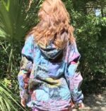 Colorful patchwork hooded jacket on a woman.