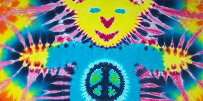 Colorful tie-dye shirt with peace sign.