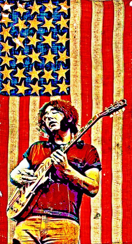 Man playing guitar in front of flag.