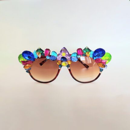 Brown sunglasses with colorful jewels.