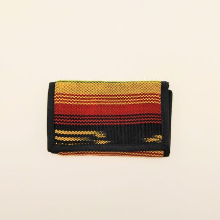 Multicolored woven wallet with black trim.