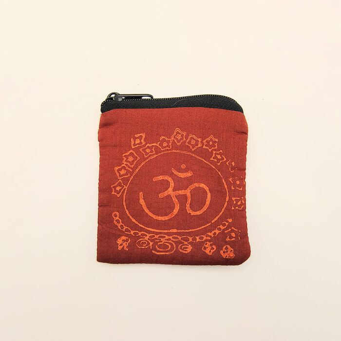 Red fabric pouch with Om symbol.