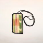 Striped fabric phone pouch with black strap.