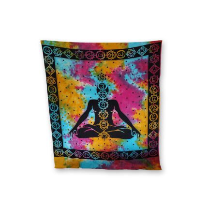 Tie-dye tapestry with chakra symbols and meditating figure.