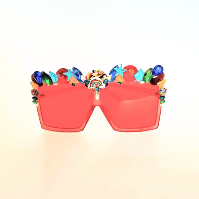 Red sunglasses with colorful embellishments.