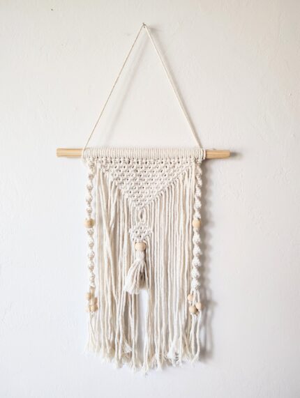 Macrame wall hanging with beads.