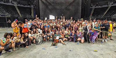 Large group of people smiling for a photo.