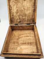 Open wooden box with hinges.