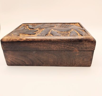 Carved wooden box with lid closed.