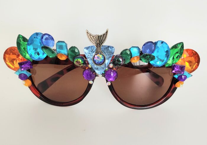 Jeweled mermaid sunglasses with brown lenses.