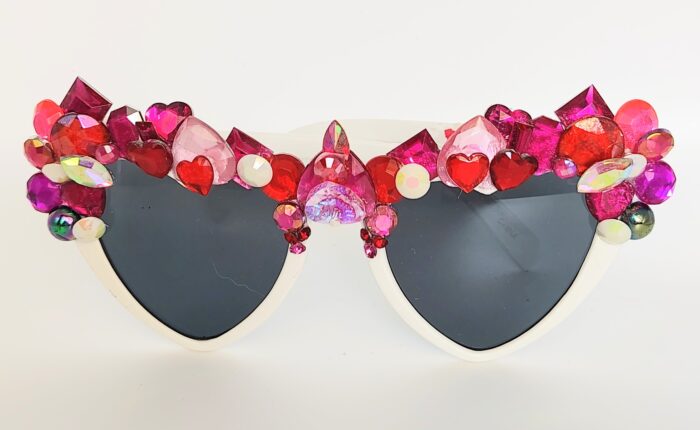 White heart-shaped sunglasses with gems.