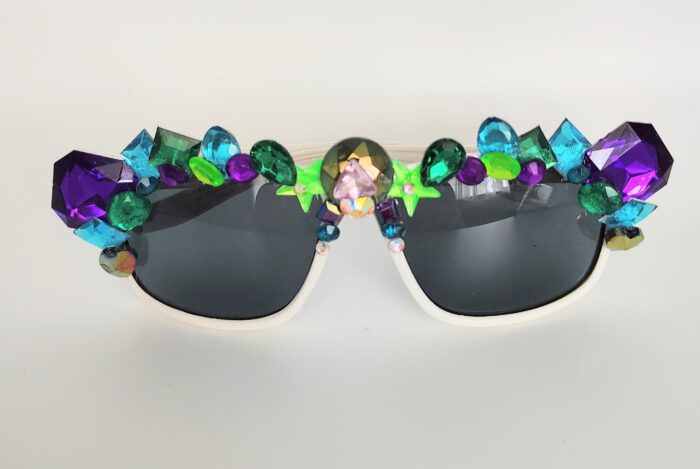 White sunglasses with colorful gems.