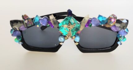 Black sunglasses with colorful gemstone accents.