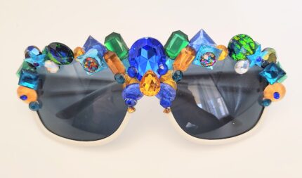 White sunglasses with colorful rhinestones.