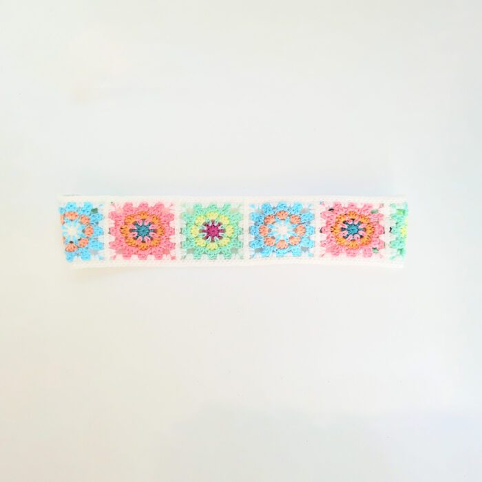 Crochet headband with colorful squares.