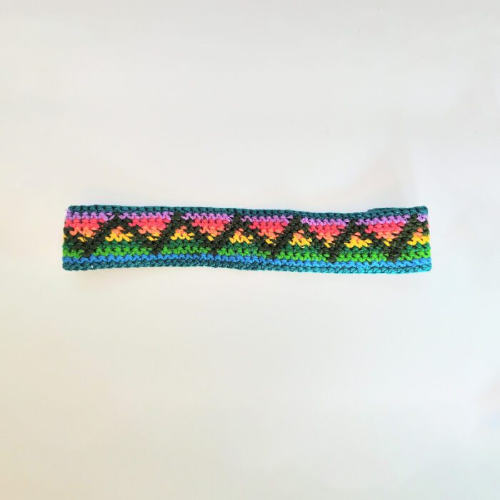 Crocheted headband with colorful pattern.