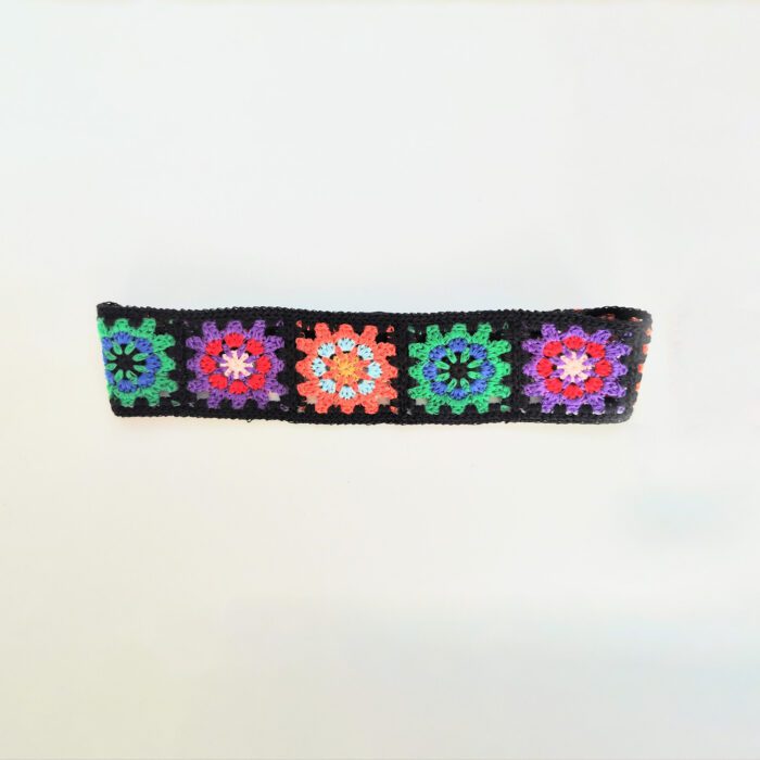 Crocheted headband with colorful flowers.