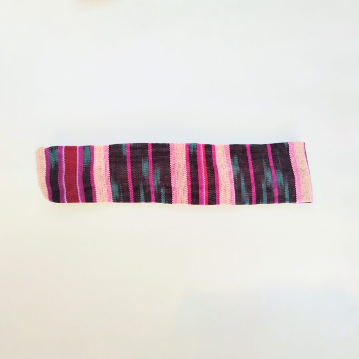 Striped fabric with pink and black stripes.