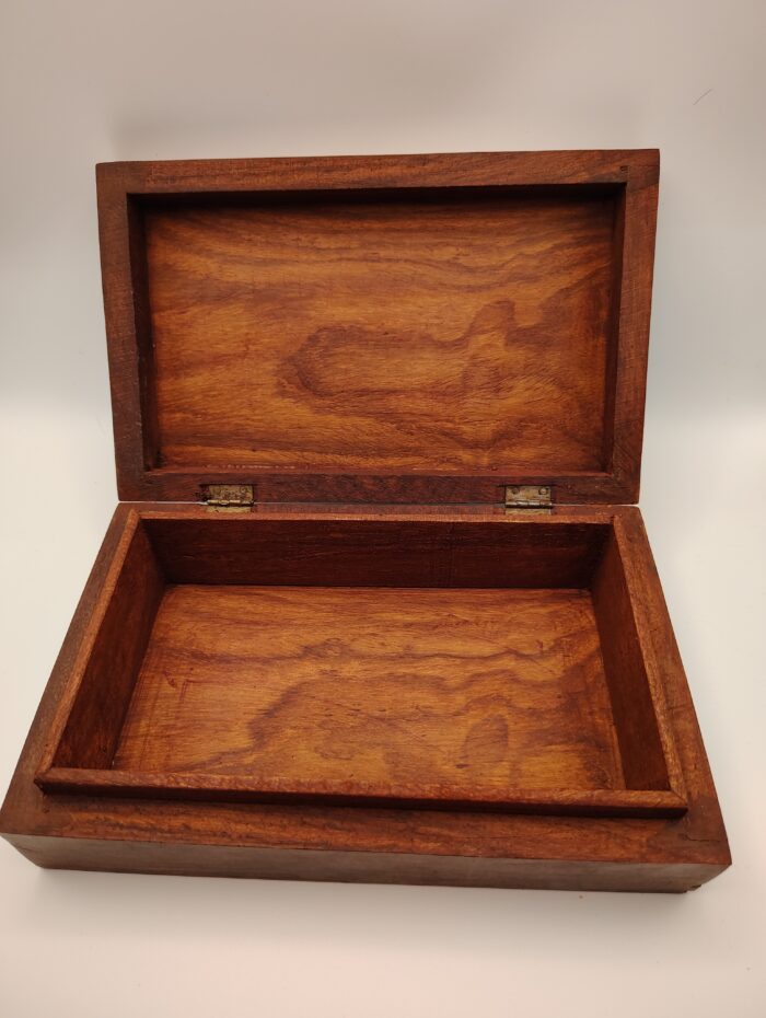 Open wooden box with hinges.