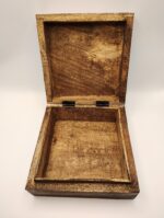 Open wooden box with hinged lid.