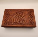 Carved wooden box with dreamcatcher design.