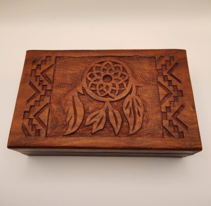 Carved wooden box with dreamcatcher design.