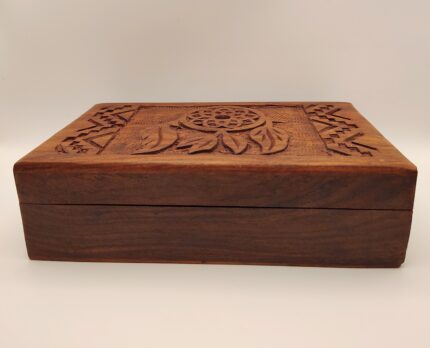 Carved wooden box with dreamcatcher design.