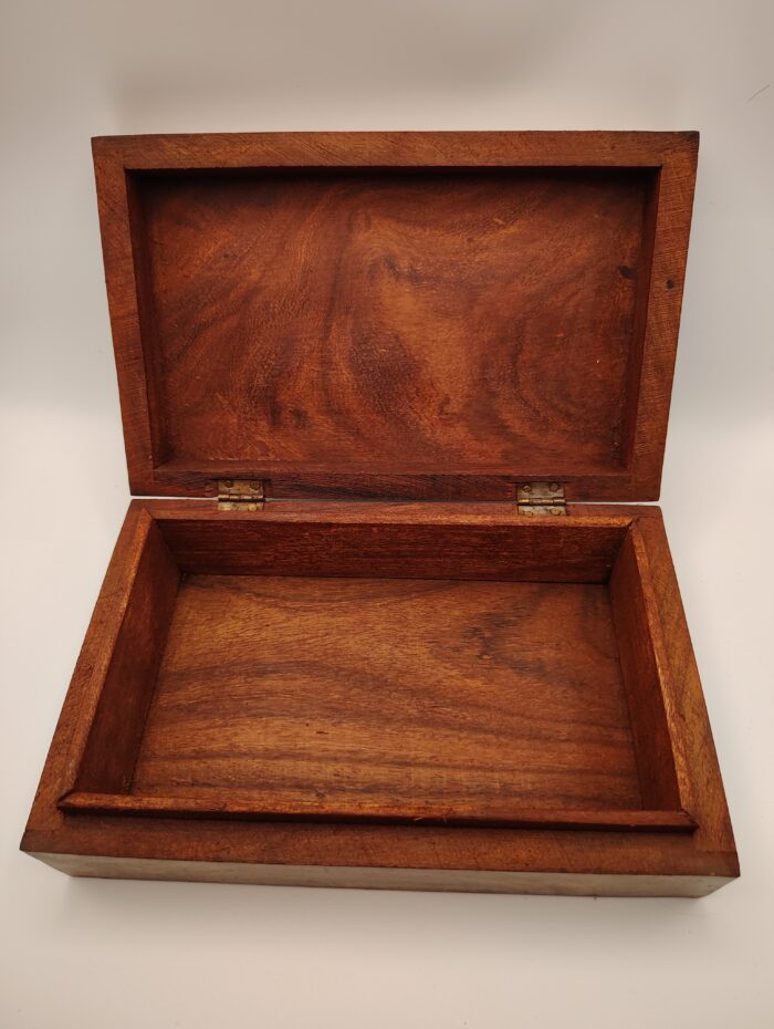 Wooden box open with hinges visible.