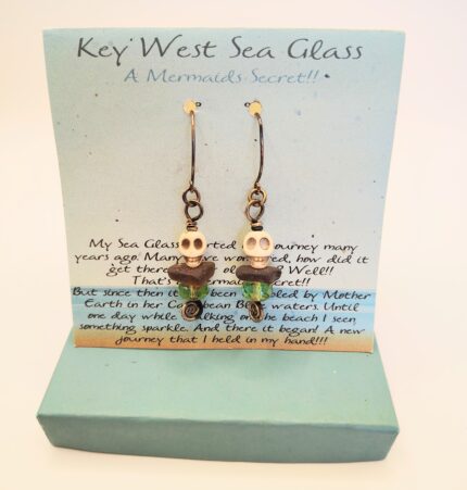 Sea glass skull earrings on card.