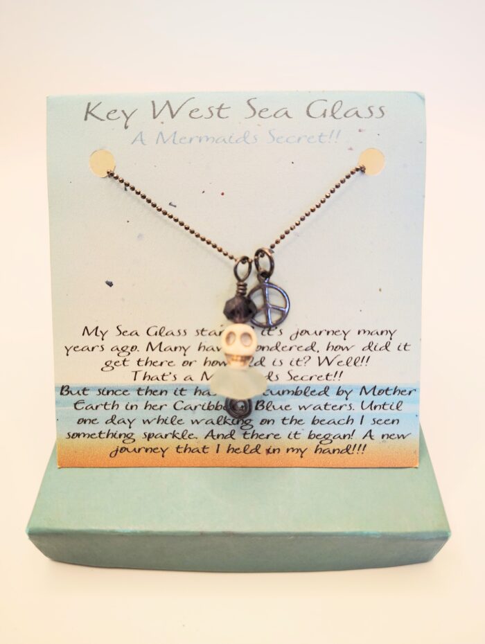 Key West Sea Glass necklace with skull and peace sign charm.