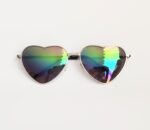 Silver heart-shaped iridescent sunglasses.