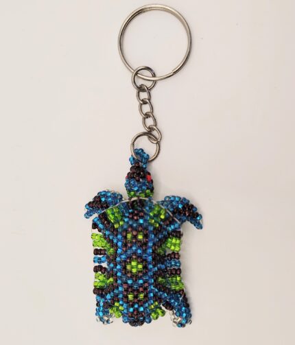 Beaded turtle keychain on white background.