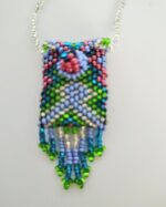 Beaded necklace with green and blue fringe.