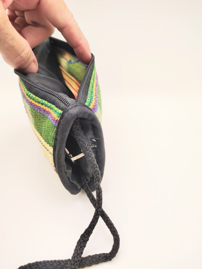 Striped zippered pouch with black cord.