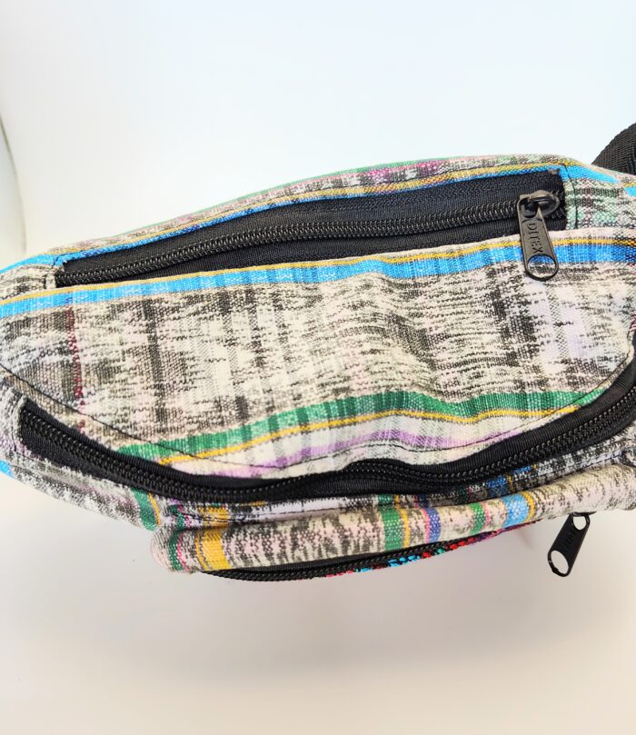 Striped fabric fanny pack with zipper.