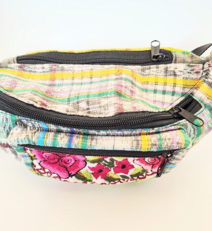 Colorful embroidered fanny pack with zipper.