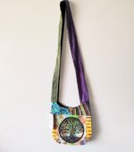 Patchwork shoulder bag with tree of life design.