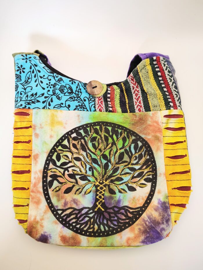 Tie-dye bag with embroidered tree of life.