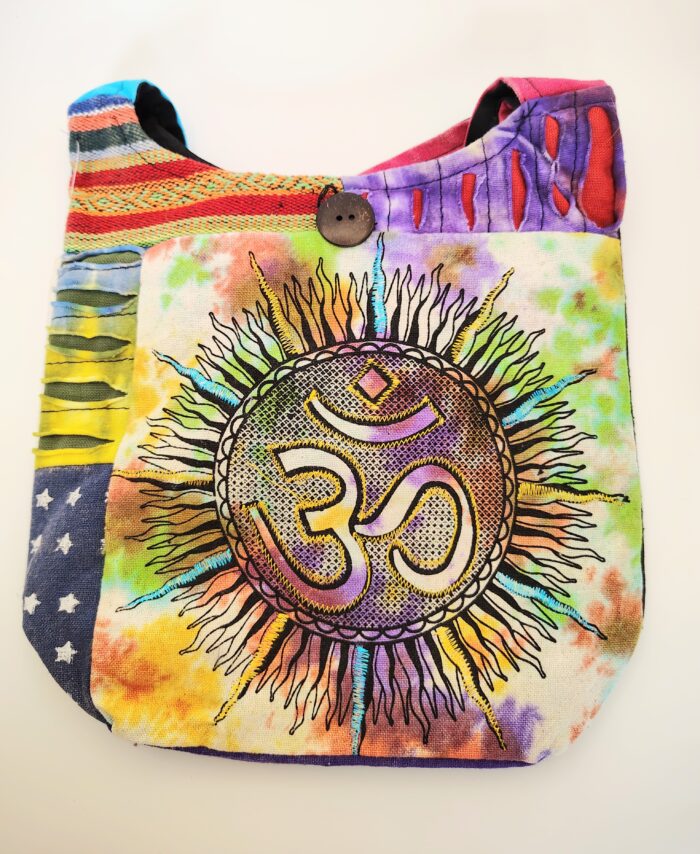 Patchwork bag with Om symbol and sun.